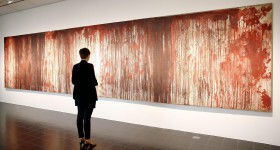 epa04336643 A visitor stands in front of the painting 'Untitled (Kreuzbluttriptychon 1)' by Austrian artist Hermann Nitsch at the 'Kunsthalle' in Hamburg, Germany, 31 July 2014. The Hamburg Kunsthalle is remaining open despite modernization works. Some 200 masterpieces from the museum's permanent collection will be on display under the title 'Spot On' at the Kunsthalle's 'Galerie der Gegenwart' (Galery of Contemporary Art) until 03 January 2016.  EPA/MALTE CHRISTIANS