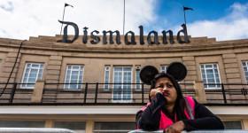 WESTON-SUPER-MARE, ENGLAND - AUGUST 20:  A steward is seen outside Banksy's 'Dismaland' exhibition, which opens tomorrow, at a derelict seafront lido on August 20, 2015 in Weston-Super-Mare, England. The show is Banskys first in the UK since the Banksy v Bristol Museum show in 2009 and will be open for 5 weeks at the Topicana site.  (Photo by Matthew Horwood/Getty Images)