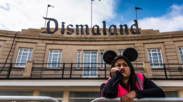 WESTON-SUPER-MARE, ENGLAND - AUGUST 20:  A steward is seen outside Banksy's 'Dismaland' exhibition, which opens tomorrow, at a derelict seafront lido on August 20, 2015 in Weston-Super-Mare, England. The show is Banskys first in the UK since the Banksy v Bristol Museum show in 2009 and will be open for 5 weeks at the Topicana site.  (Photo by Matthew Horwood/Getty Images)