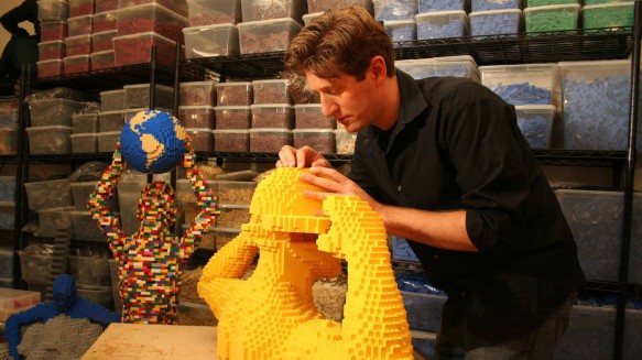 Lego brick artist Nathan Sawaya in his studio. Can you guess how many bricks he has?